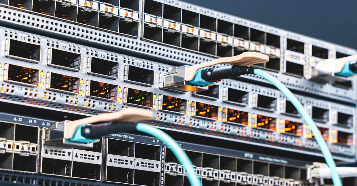 A server and its wiring in a datacenter, the physical hardware behind a dedicated server