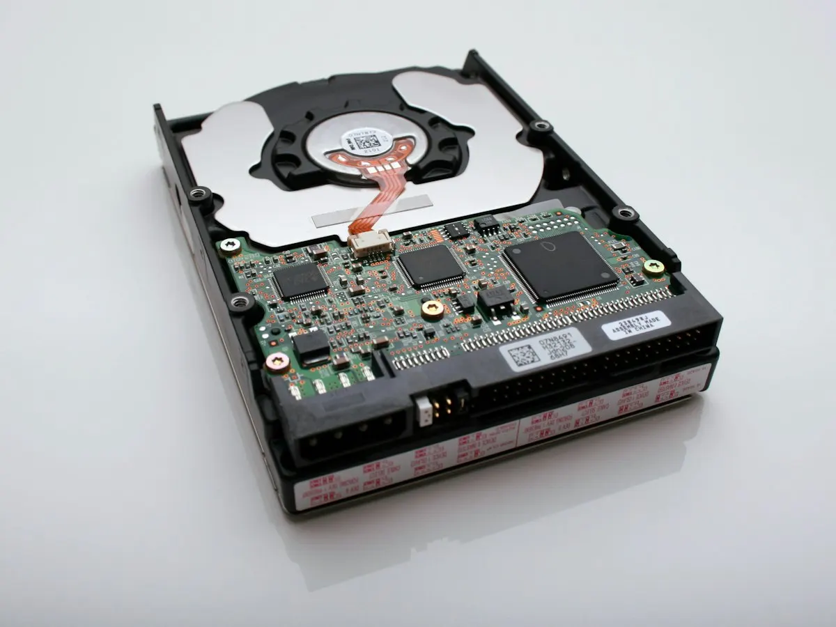 A 3.5-inch hard disk turned over to show its circuit board: a pulled or retired disk is the copy LUKS protects